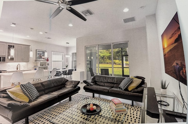 living room with sink and ceiling fan