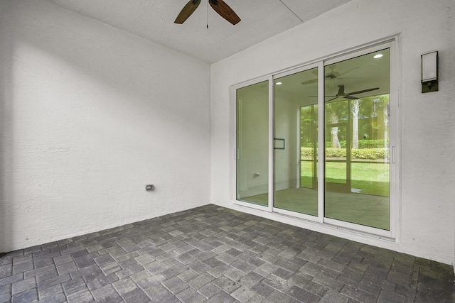 view of patio with ceiling fan