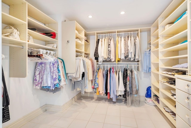 walk in closet with tile patterned flooring