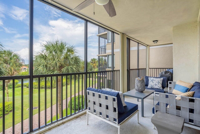 sunroom / solarium featuring ceiling fan