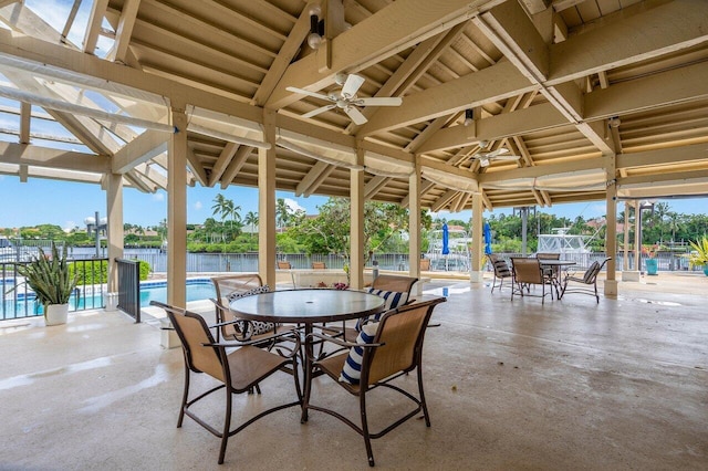 view of patio / terrace with a water view and ceiling fan