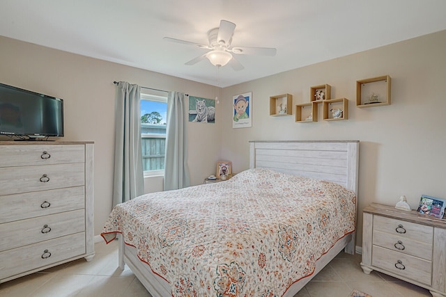 tiled bedroom with ceiling fan