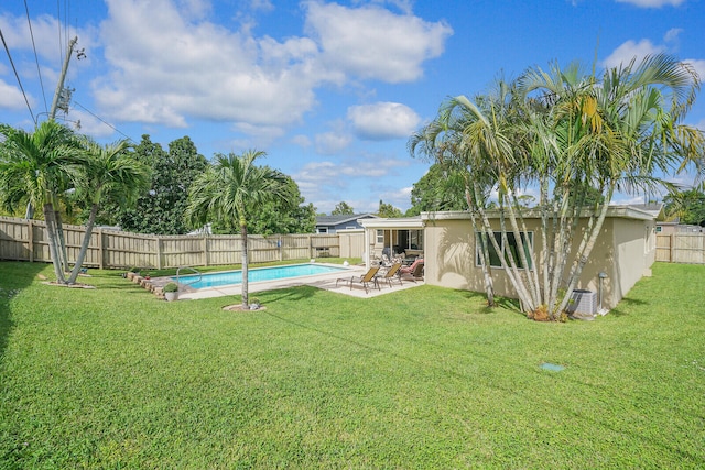 view of yard featuring a patio area and a fenced in pool