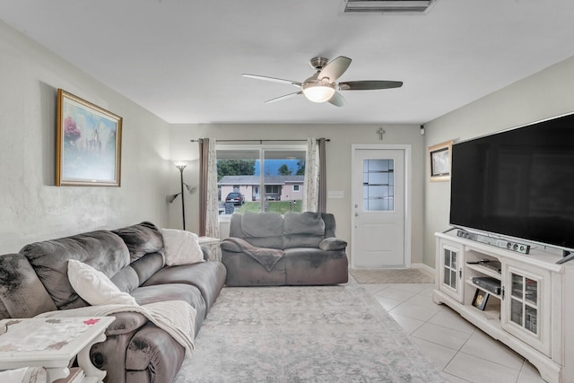 living room featuring ceiling fan and light tile patterned floors