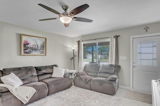 tiled living room featuring ceiling fan