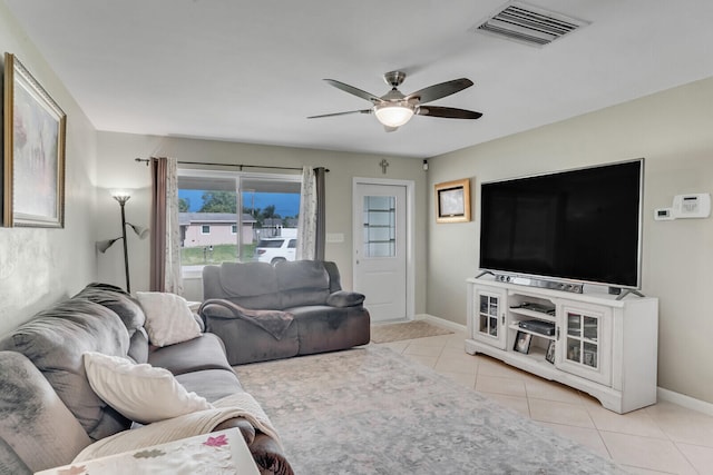 living room featuring ceiling fan and light tile patterned flooring