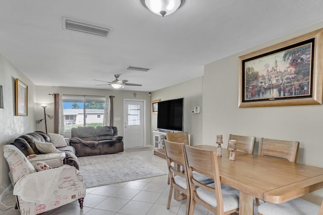 tiled dining room featuring ceiling fan