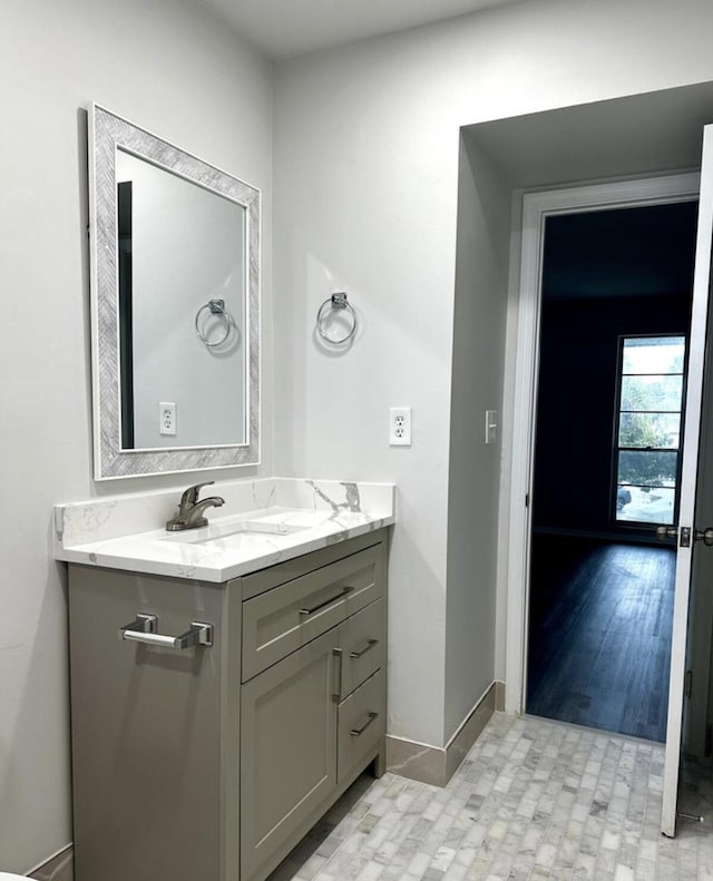 bathroom featuring hardwood / wood-style floors and vanity