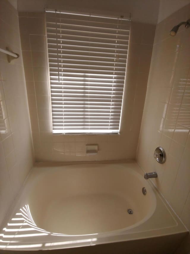 bathroom featuring washtub / shower combination