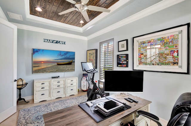 office with ornamental molding, ceiling fan, and a raised ceiling