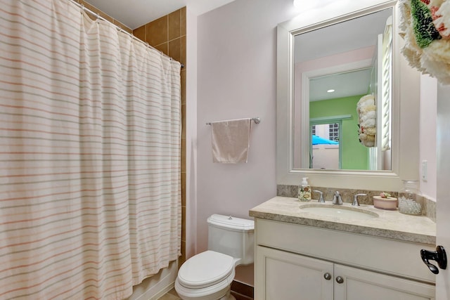 full bathroom featuring toilet, vanity, and shower / bathtub combination with curtain