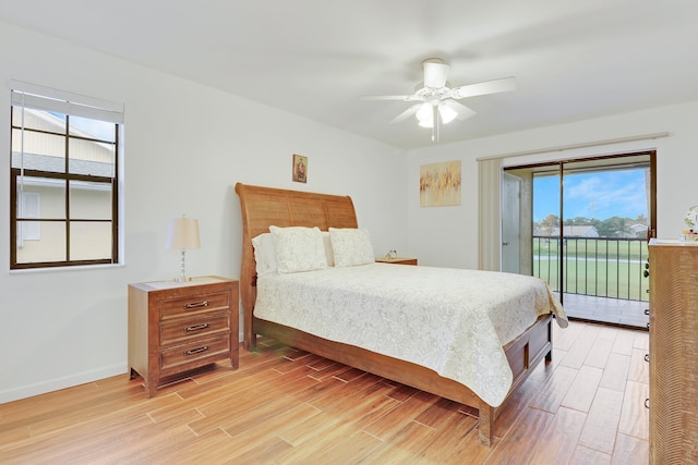 bedroom featuring light hardwood / wood-style floors, ceiling fan, and access to outside