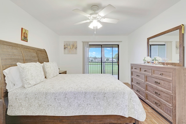 bedroom featuring access to outside, hardwood / wood-style floors, and ceiling fan