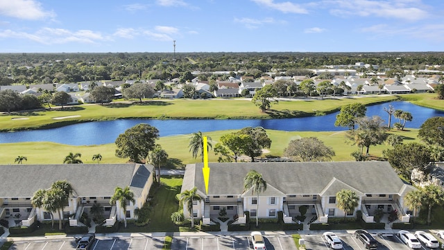 bird's eye view with view of golf course, a water view, and a residential view