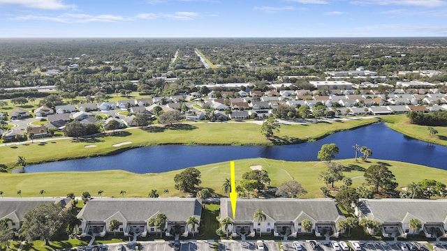 birds eye view of property featuring a residential view, view of golf course, and a water view