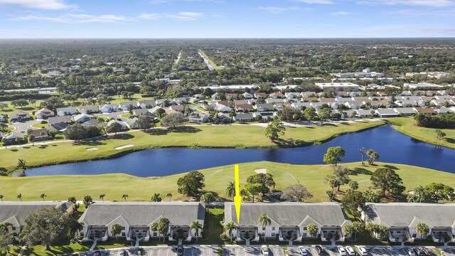 birds eye view of property with a residential view, view of golf course, and a water view