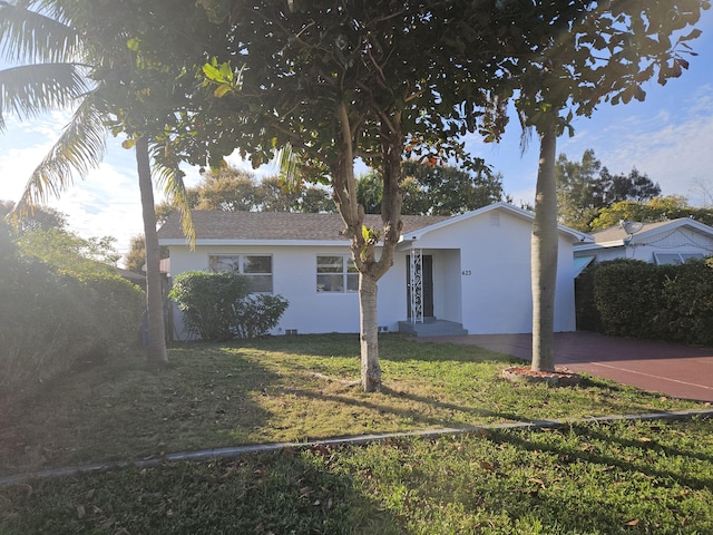 ranch-style home featuring a front yard