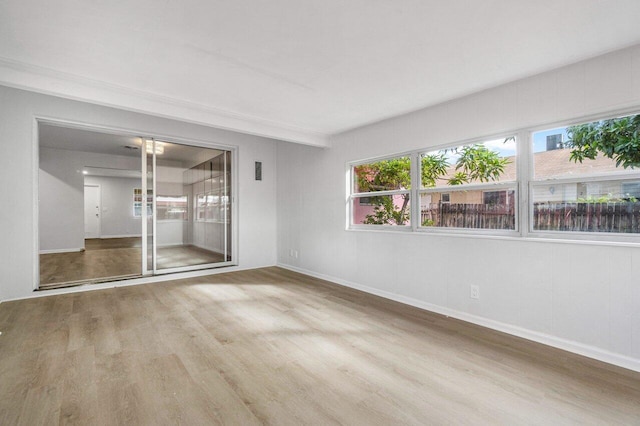 unfurnished room featuring hardwood / wood-style flooring