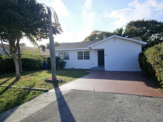 ranch-style house with a front yard