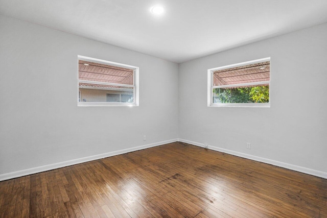 spare room featuring hardwood / wood-style flooring