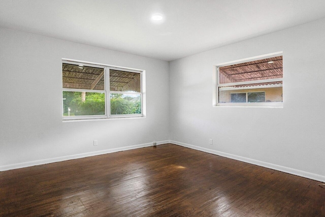 unfurnished room featuring hardwood / wood-style flooring