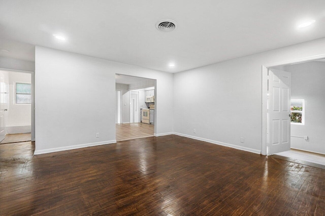 unfurnished room with hardwood / wood-style floors