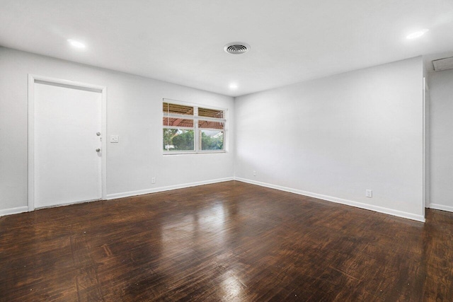 empty room with dark hardwood / wood-style floors