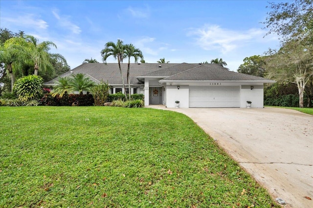 single story home with a front yard and a garage