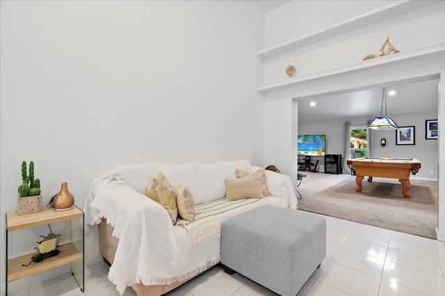 living room featuring light tile patterned floors and pool table