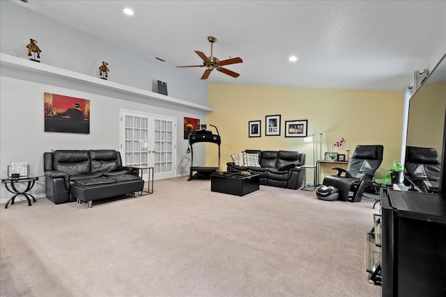 living room with french doors, light colored carpet, ceiling fan, and lofted ceiling