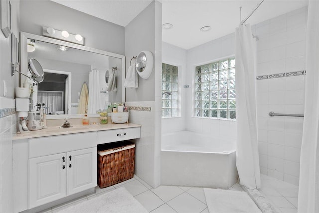 bathroom with tile patterned flooring, shower / bath combination with curtain, and vanity