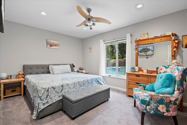 bedroom with ceiling fan and light colored carpet