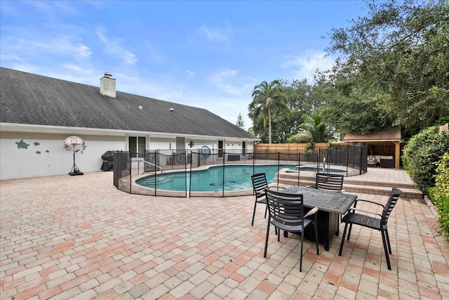 view of swimming pool featuring a patio