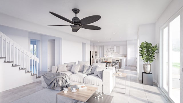 living room featuring a wealth of natural light, light tile patterned floors, and ceiling fan