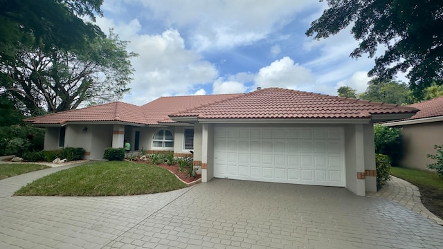 view of front of property with a garage