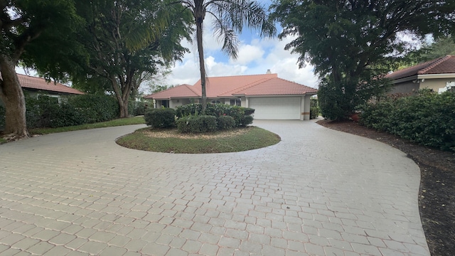 view of front of property with a garage