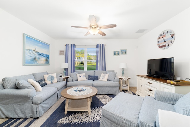 living room with ceiling fan and carpet floors