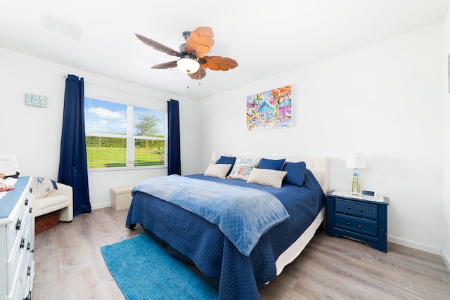 bedroom with ceiling fan and light wood-type flooring