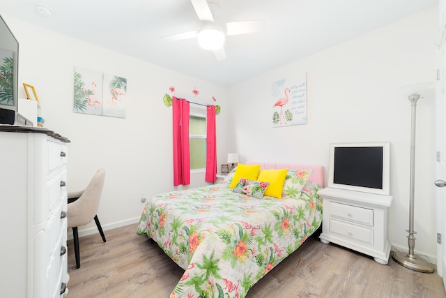 bedroom featuring hardwood / wood-style floors and ceiling fan