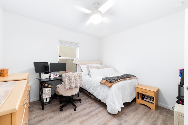 bedroom featuring ceiling fan and light wood-type flooring