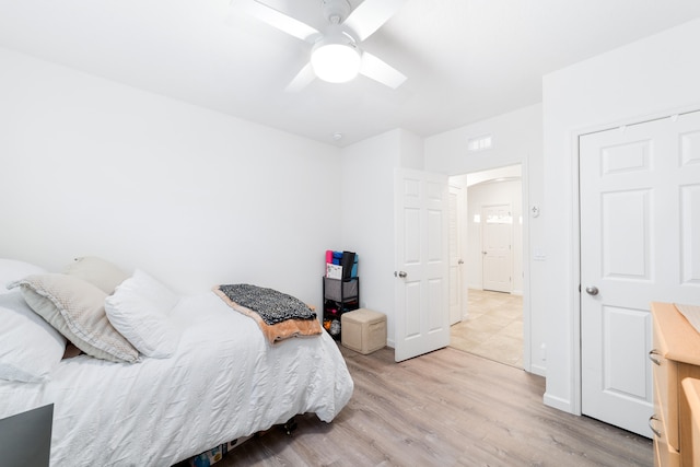 bedroom featuring light wood-type flooring and ceiling fan