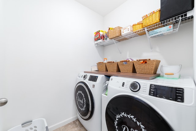 laundry room featuring separate washer and dryer and light tile patterned floors