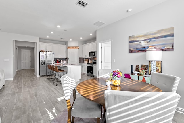 dining room with light hardwood / wood-style floors