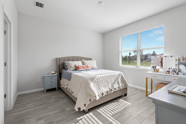 bedroom with light wood-type flooring