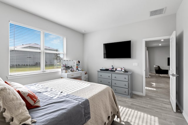 bedroom with light wood-type flooring