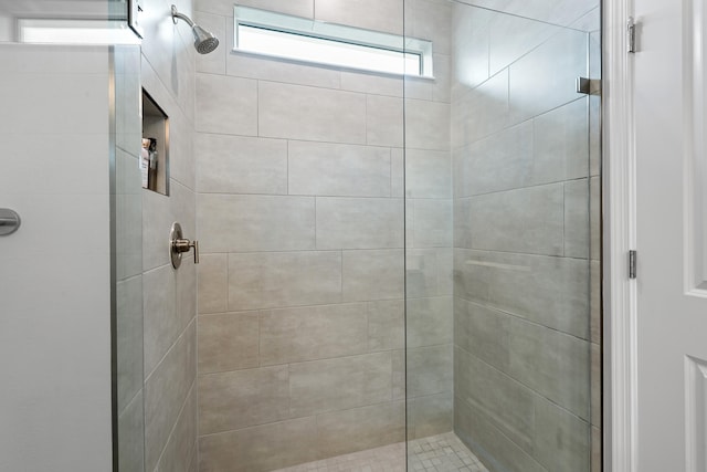 bathroom with tiled shower