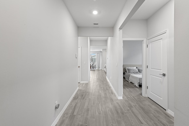 hall with light wood-type flooring