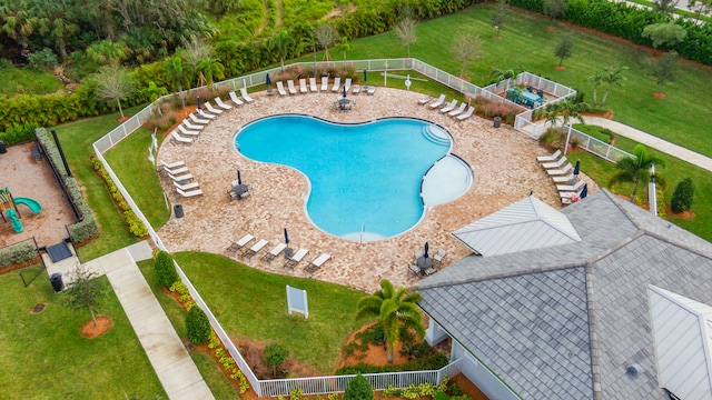 view of pool with a lawn and a patio area