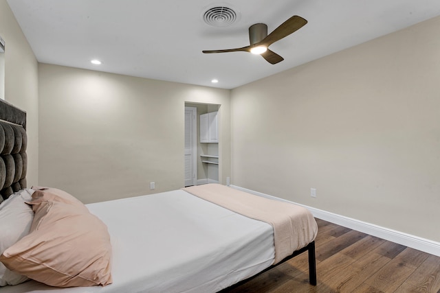 bedroom with hardwood / wood-style flooring and ceiling fan