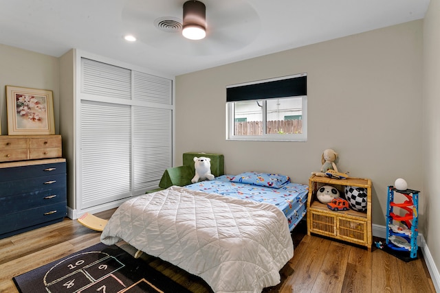 bedroom featuring wood-type flooring and ceiling fan